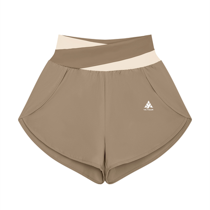 YA TOUR Women's Tennis Panelled Shorts – Light Coffee with Apricot crossover color block waistband, front flat lay showing high-waist design, inner liner and overlay construction
