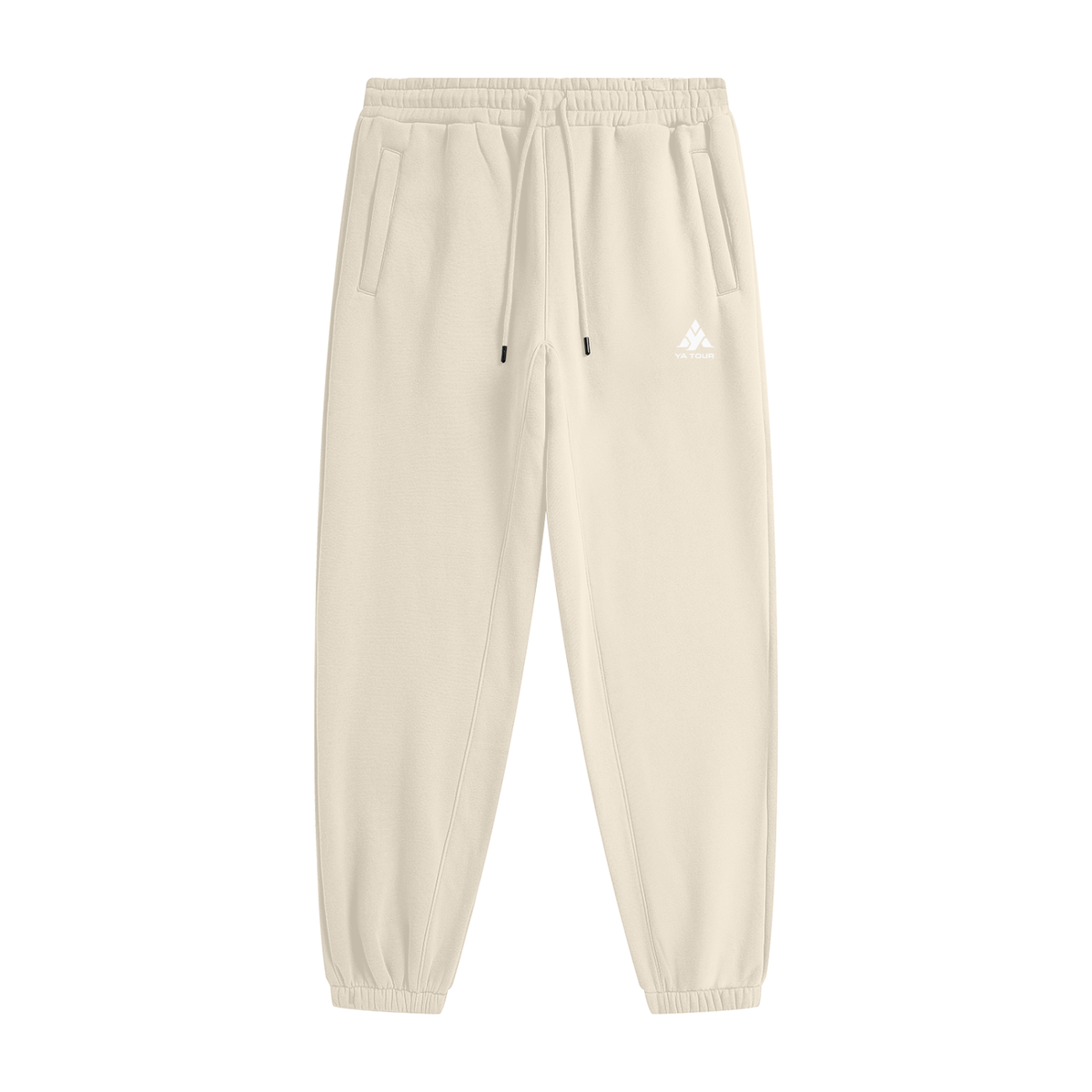 YA TOUR Unisex Heavyweight Fleece Joggers – Cream Apricot, front flat lay showing mid-rise elastic waistband with drawstring, side pockets, tapered cuff and YA TOUR logo