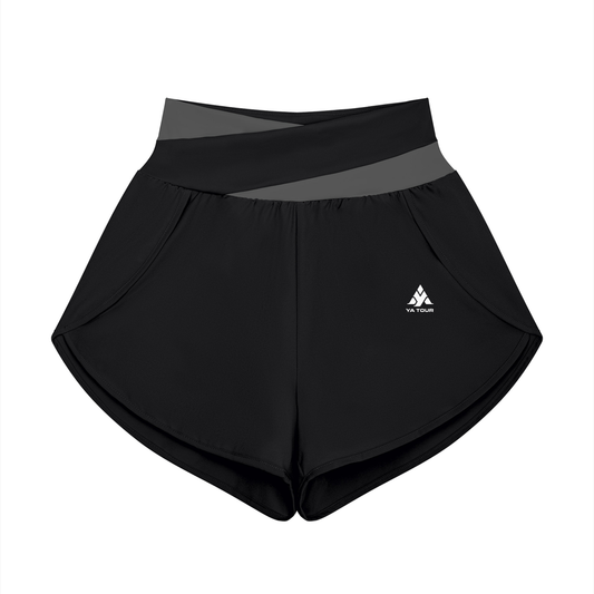 YA TOUR Women's Tennis Panelled Shorts – Black with Dark Gray crossover color block waistband, front flat lay showing high-waist design, inner liner and overlay construction