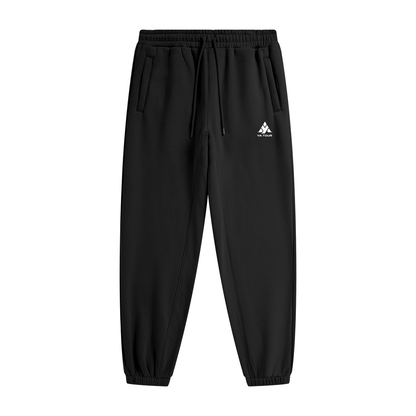 YA TOUR Unisex Heavyweight Fleece Joggers – Black, front flat lay showing mid-rise elastic waistband with drawstring, side pockets, tapered cuff and YA TOUR logo