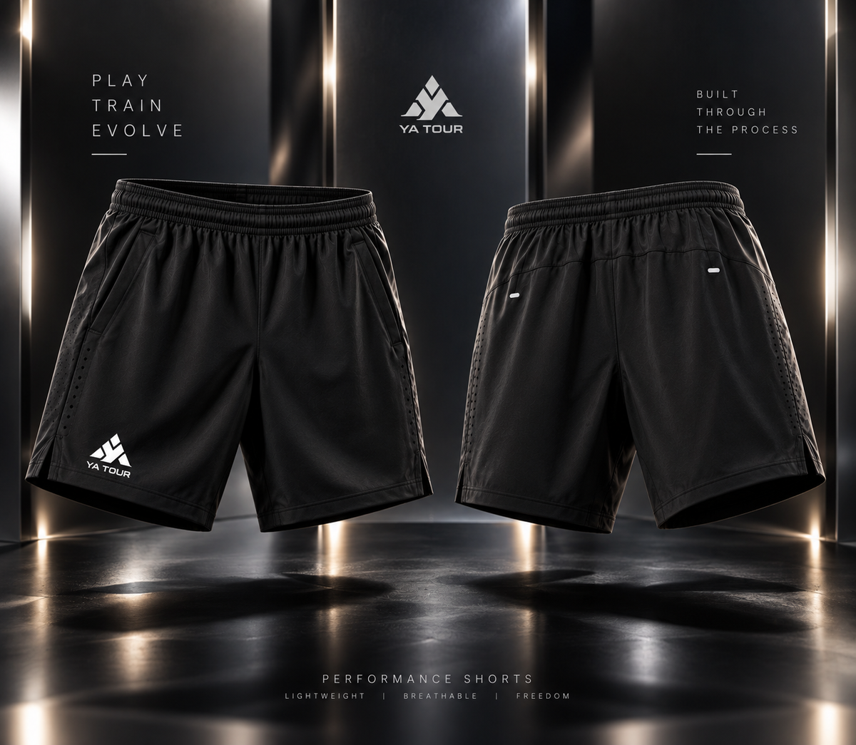 YA TOUR Men's Performance Shorts – Black, front and back product display showing elastic waistband, side pockets, side vent hem and YA TOUR logo on left leg in dark gold-lit studio setting