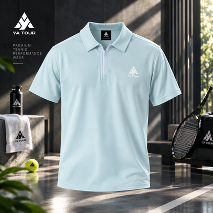 YA TOUR Contrast Collar Raglan Polo Shirt – Light Blue, studio product shot showing front view with quarter-zip closure, YA TOUR chest logo, and tennis court lifestyle props