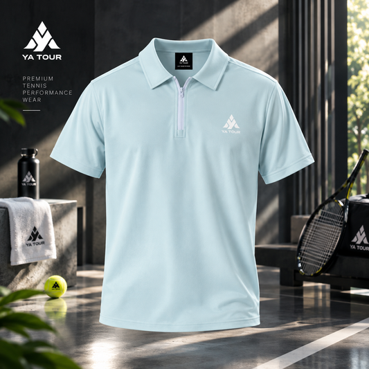 YA TOUR Contrast Collar Raglan Polo Shirt – Light Blue, studio product shot showing front view with quarter-zip closure, YA TOUR chest logo, and tennis court lifestyle props