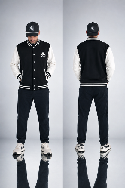 YA TOUR Two-Tone Fleeced Varsity Jacket – Black with White sleeves, on-model front and back editorial view showing snap button closure, ribbed collar, cuffs and hem, YA TOUR logo on chest, styled with YA TOUR black joggers and black cap