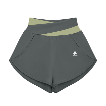 YA TOUR Women's Tennis Panelled Shorts – Dark Gray with Bean Green crossover color block waistband, front flat lay showing high-waist design, inner liner and overlay construction