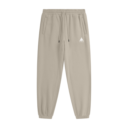 YA TOUR Unisex Heavyweight Fleece Joggers – Gray Apricot, front flat lay showing mid-rise elastic waistband with drawstring, side pockets, tapered cuff and YA TOUR logo