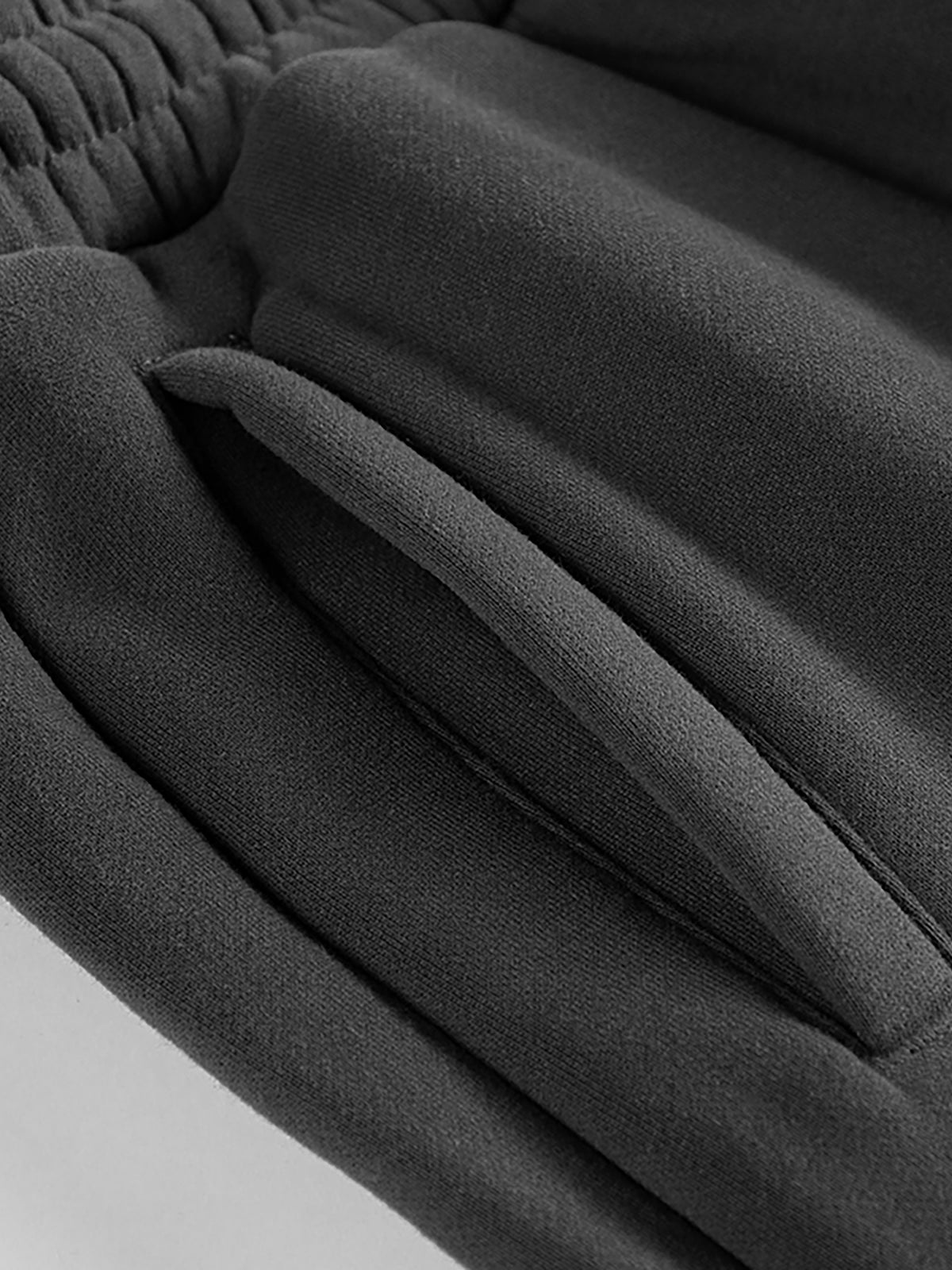 YA TOUR Unisex Heavyweight Fleece Joggers – close-up of side pocket and YA TOUR logo on heavyweight fleece fabric showing 10.2 oz cotton-poly blend texture