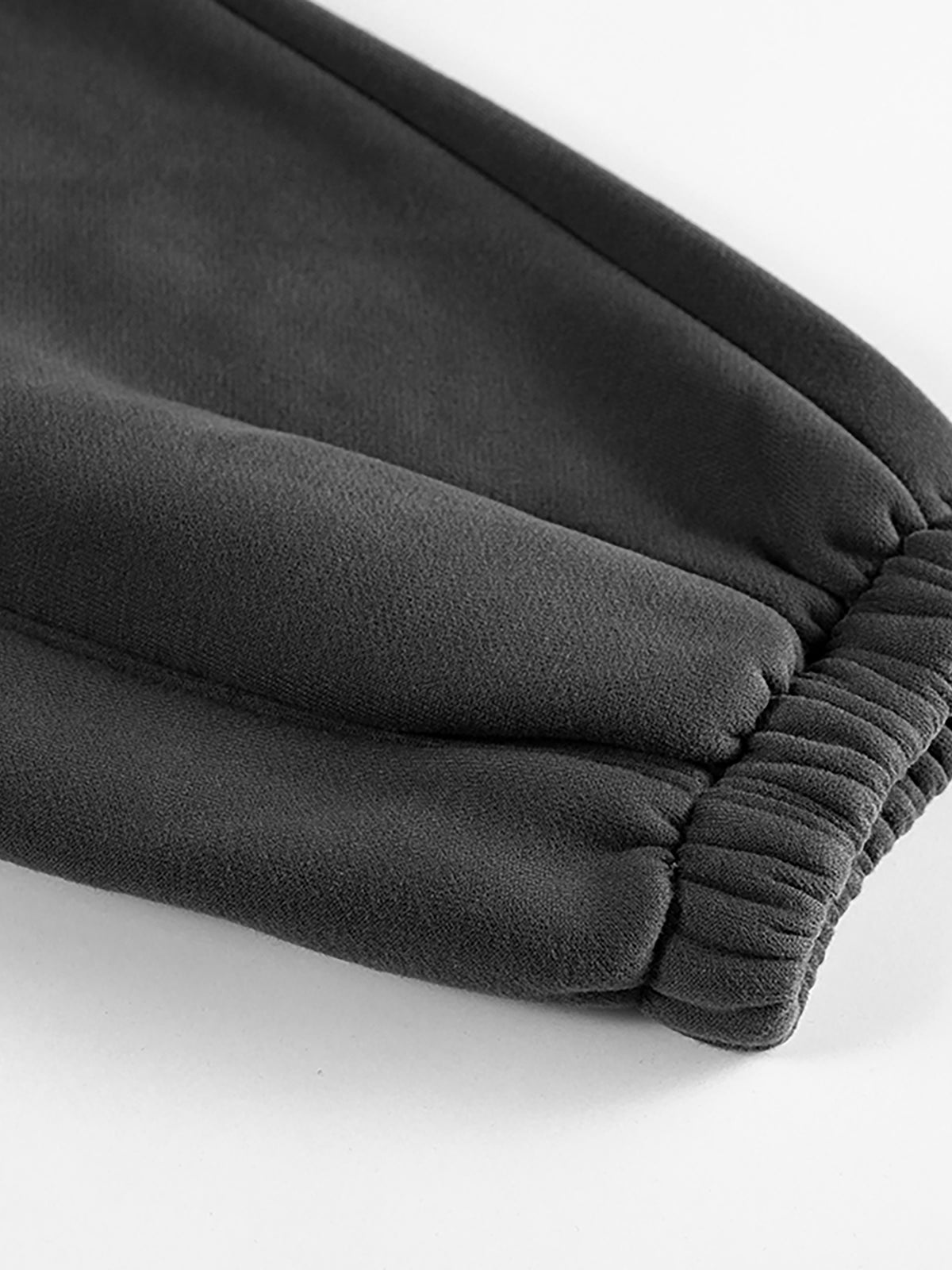 YA TOUR Unisex Heavyweight Fleece Joggers – close-up of tapered ankle cuff showing elastic ribbed finish and heavyweight fleece construction