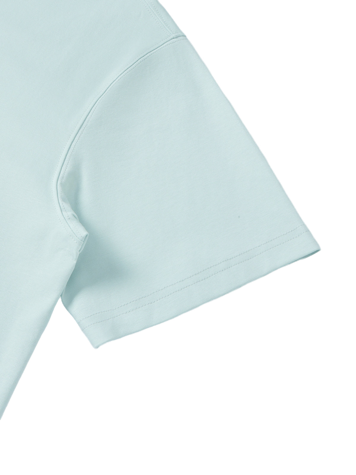YA TOUR Unisex Quarter-Zip Polo Shirt – Light Blue, sleeve and shoulder close-up showing fabric texture and hem construction