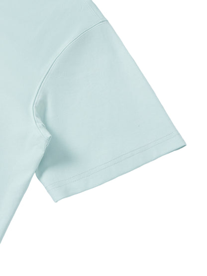 YA TOUR Unisex Quarter-Zip Polo Shirt – Light Blue, sleeve and shoulder close-up showing fabric texture and hem construction