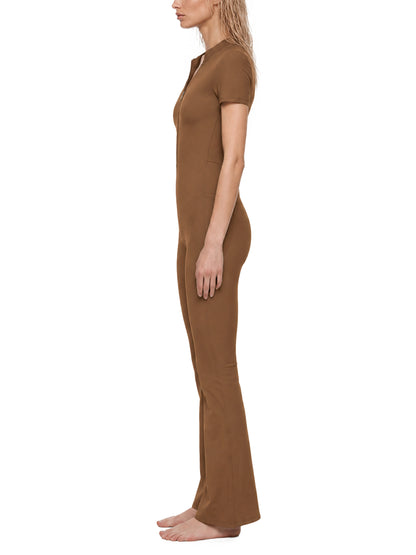 YA TOUR Women's Tight Flared Leg Quarter-Zip Jumpsuit – Brown, on-model side view showing quarter-zip neckline and flared leg silhouette