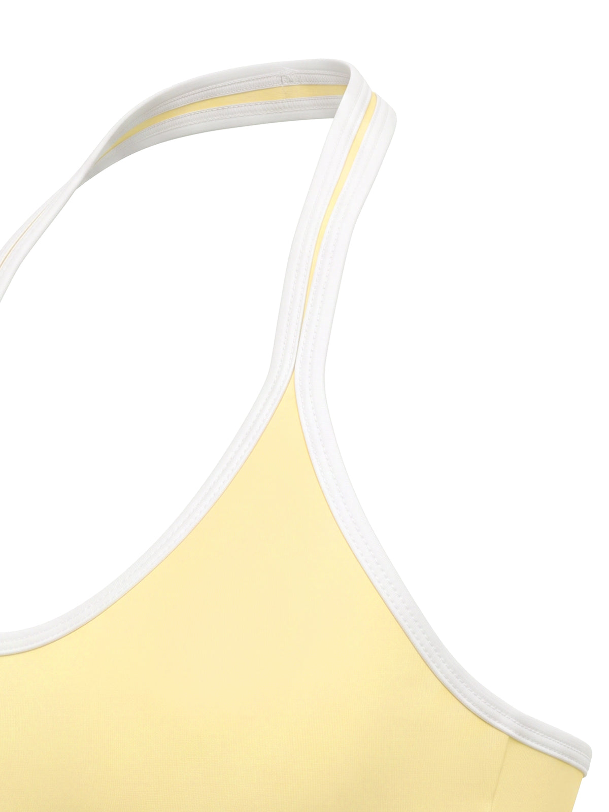 YA TOUR Women's Halter Color Block Sports Bra – Light Yellow, close-up of halter strap crossover and color block edge detail