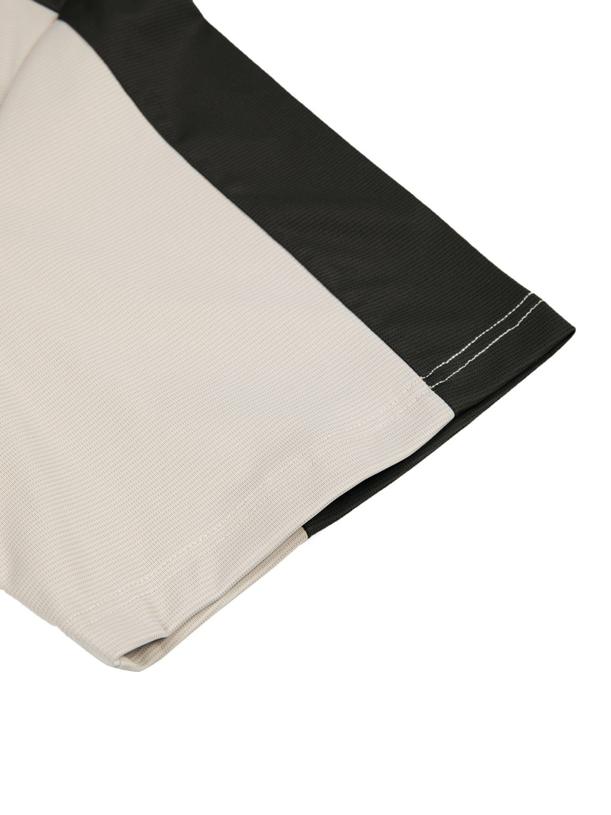 YA TOUR Men's Color Block Performance T-Shirt – Beige / Black color block, close-up of curved hem and side seam showing contrast stitching and fabric construction
