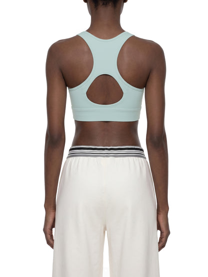 YA TOUR Women's Cropped Zip Sports Bra — on-model back view showing racerback cutout and clean fit