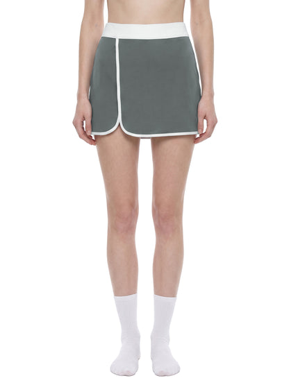 YA TOUR Women's Color Block A-Line Skort dark gray and white — on-model front view showing fit and athletic silhouette