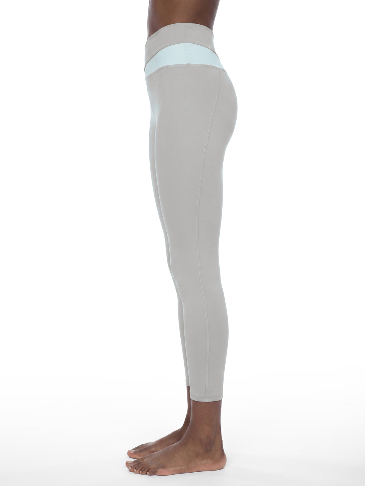 YA TOUR Women's Color Block Tennis Leggings – Light Gray with Light Blue, on-model side view showing high-waist color block waistband and full-length fitted silhouette