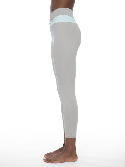 YA TOUR Women's Color Block Tennis Leggings – Light Gray with Light Blue, on-model side view showing high-waist color block waistband and full-length fitted silhouette