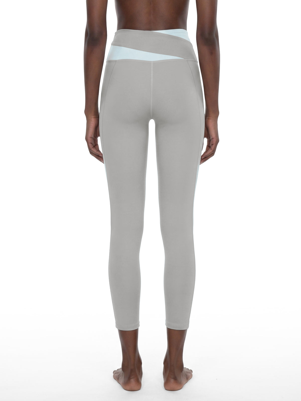 YA TOUR Women's Color Block Tennis Leggings – Light Gray with Light Blue, on-model back view showing leg fit and high-waist construction
