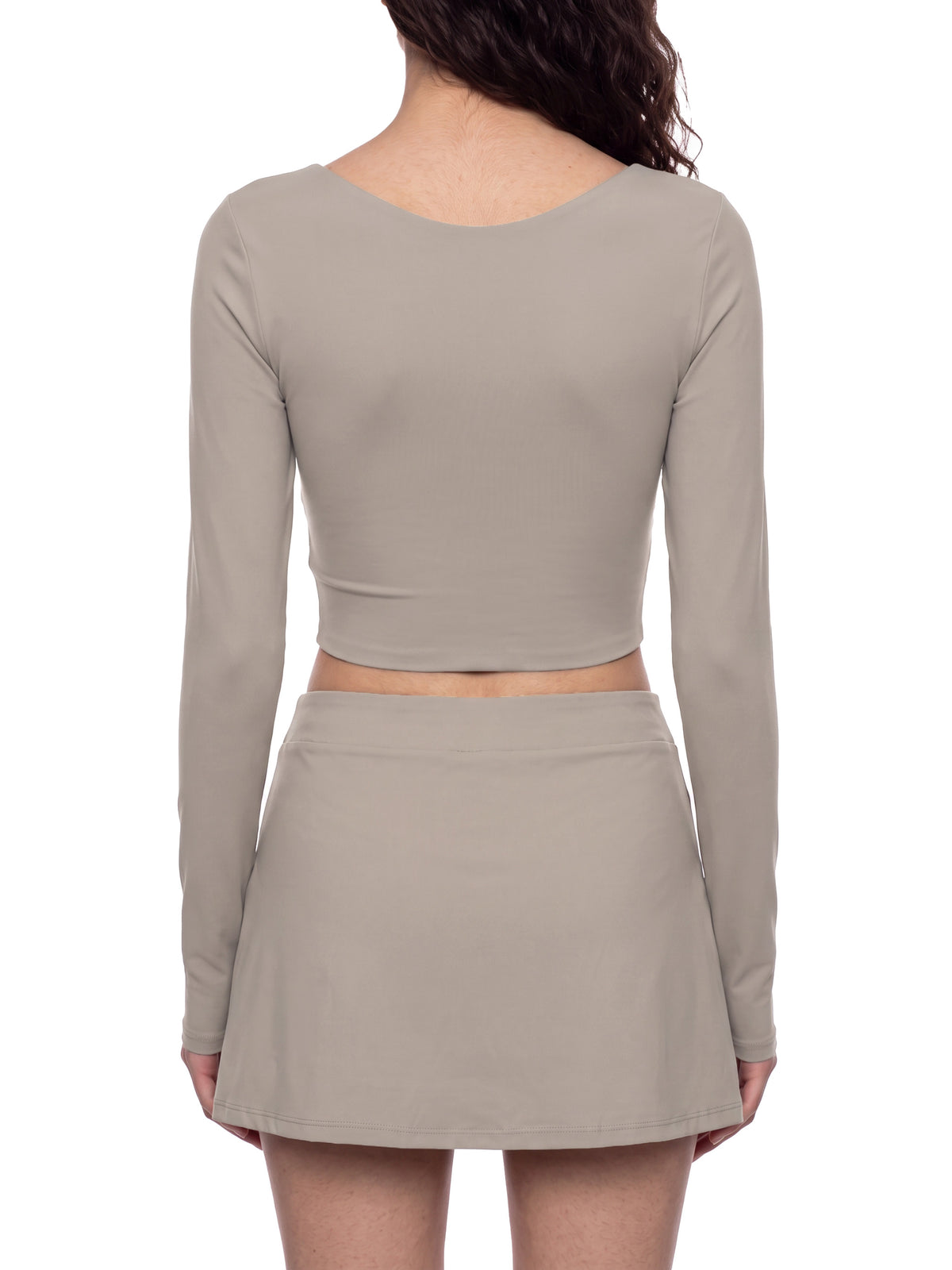 YA TOUR Women's Panelled Long Sleeve Tennis T-Shirt – Apricot with Khaki, on-model back view showing open-back U-neck design and crop silhouette