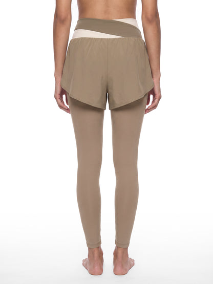 YA TOUR Women's Paneled High Waisted Shorts – Light Gray with Light Yellow, back view on model