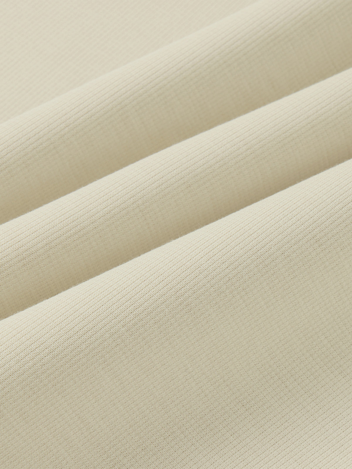 YA TOUR Unisex Stand Collar Track Jacket – Beige/Cream, close-up of polyester-cotton-spandex blend fabric texture showing midweight knit weave